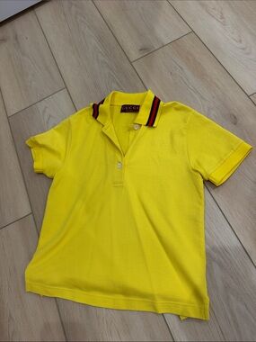 Gucci yellow polo with red stripe at collar